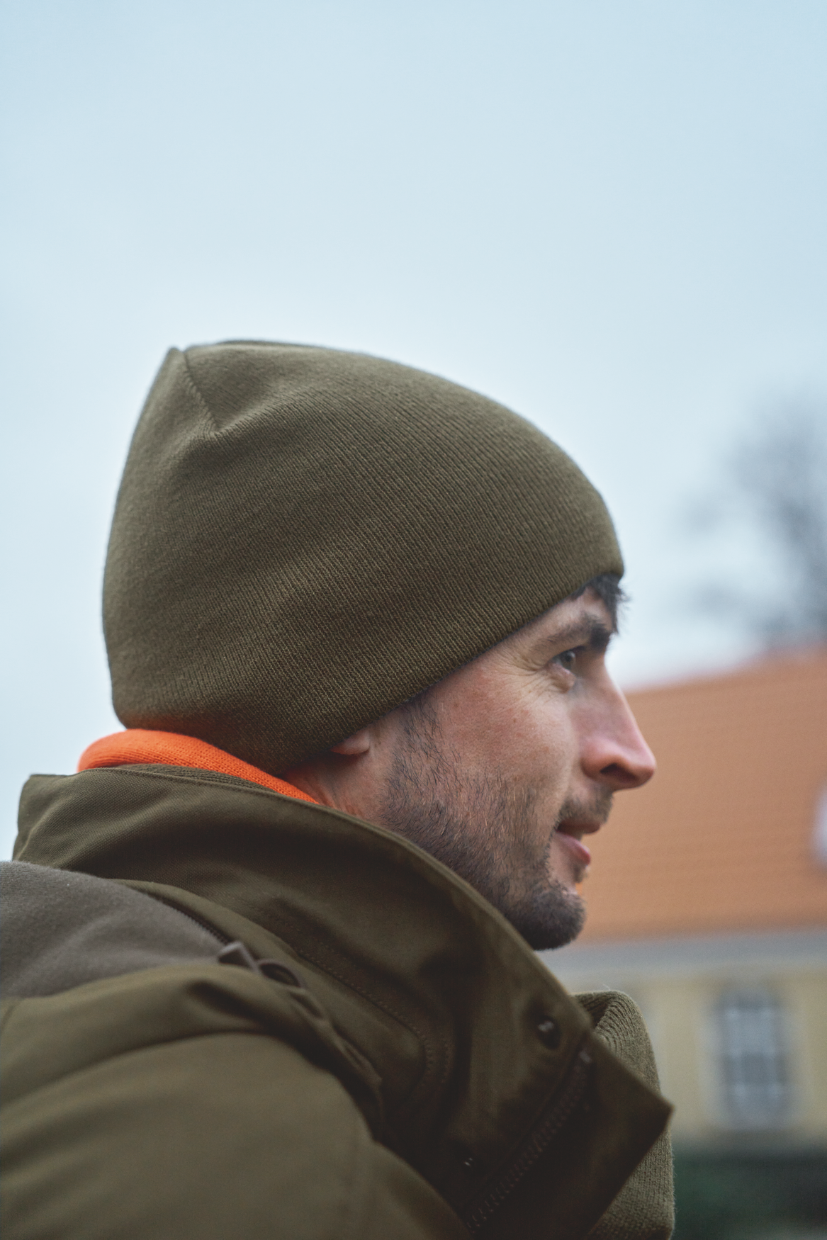 Härkila reversible beanie - Willow green/Orange
