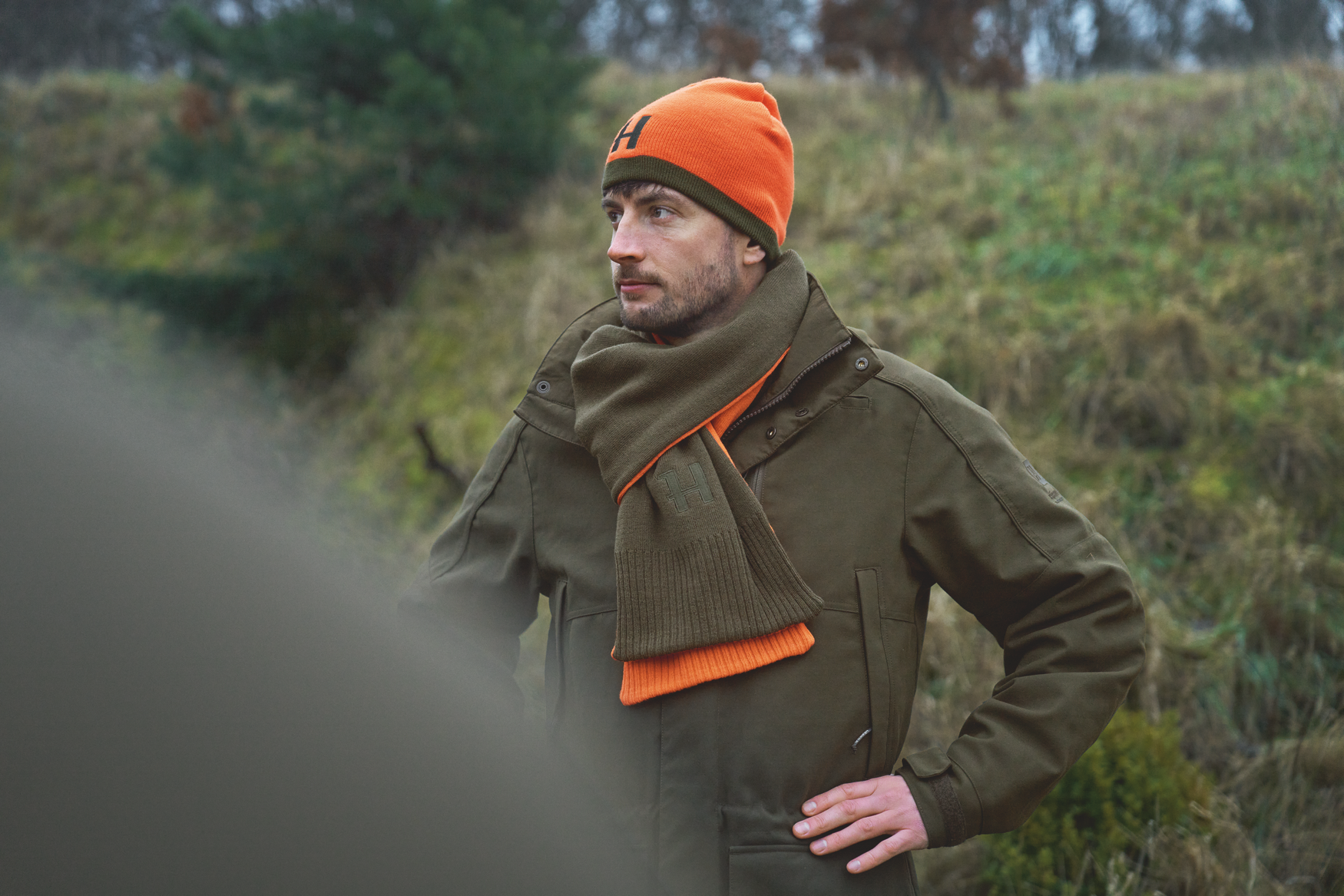 Härkila Reversible Beanie - Willow green/Orange